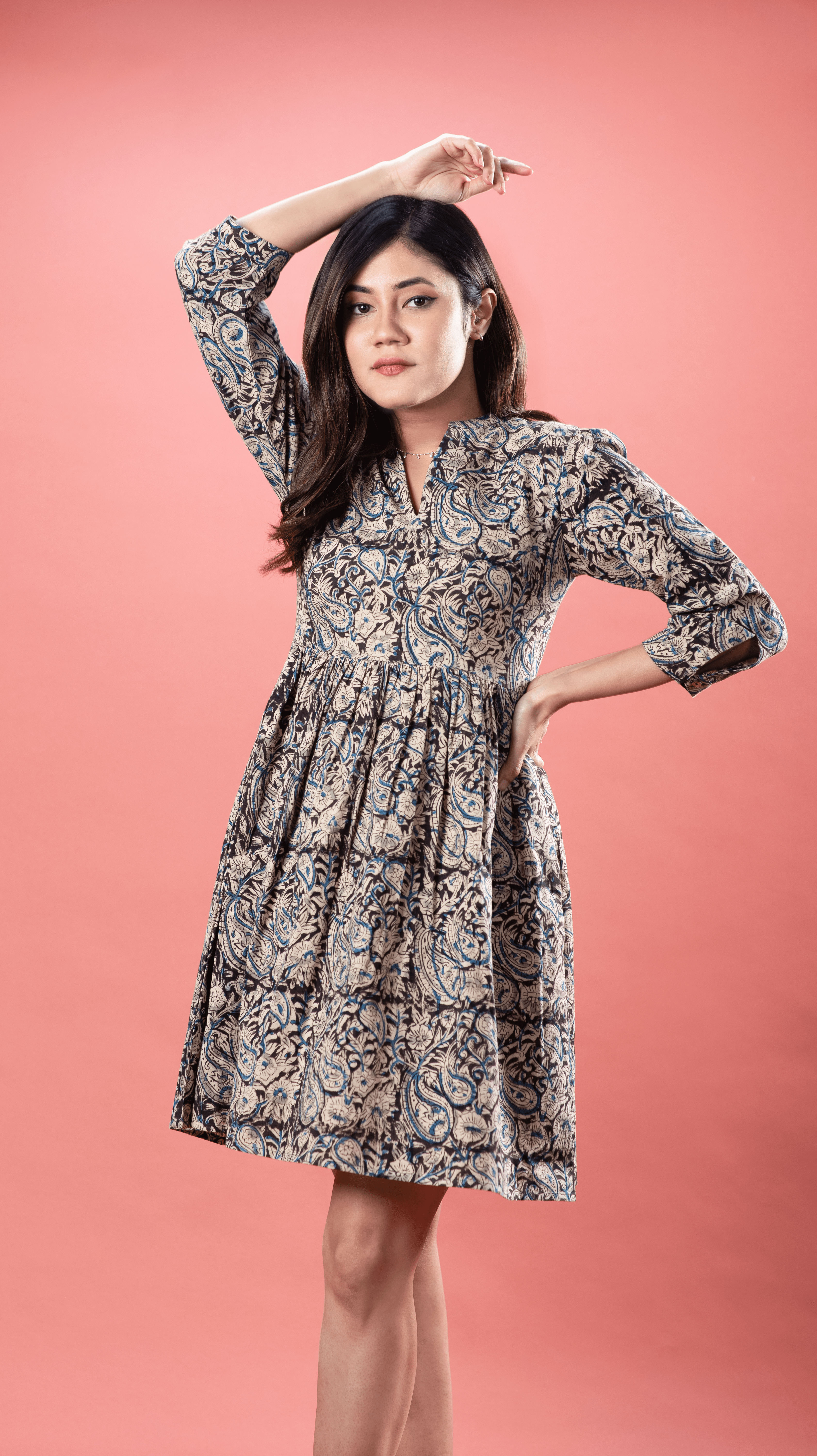 Discover chic practicality with our Kalamkari Short Dress in Paisley Blue, featuring convenient pockets. Crafted from 100% lightweight cotton, this floral print dress blends style and functionality seamlessly. Perfect for everyday wear, wash with cold water or dry clean for long-lasting beauty.