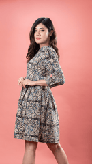 Step into elegance with our Kalamkari Short Dress in Paisley Blue, crafted from 100% lightweight cotton. This floral print midi dress offers practicality with its convenient pockets, ideal for everyday wear. Care instructions: Hand wash separately or dry clean to maintain its beauty.