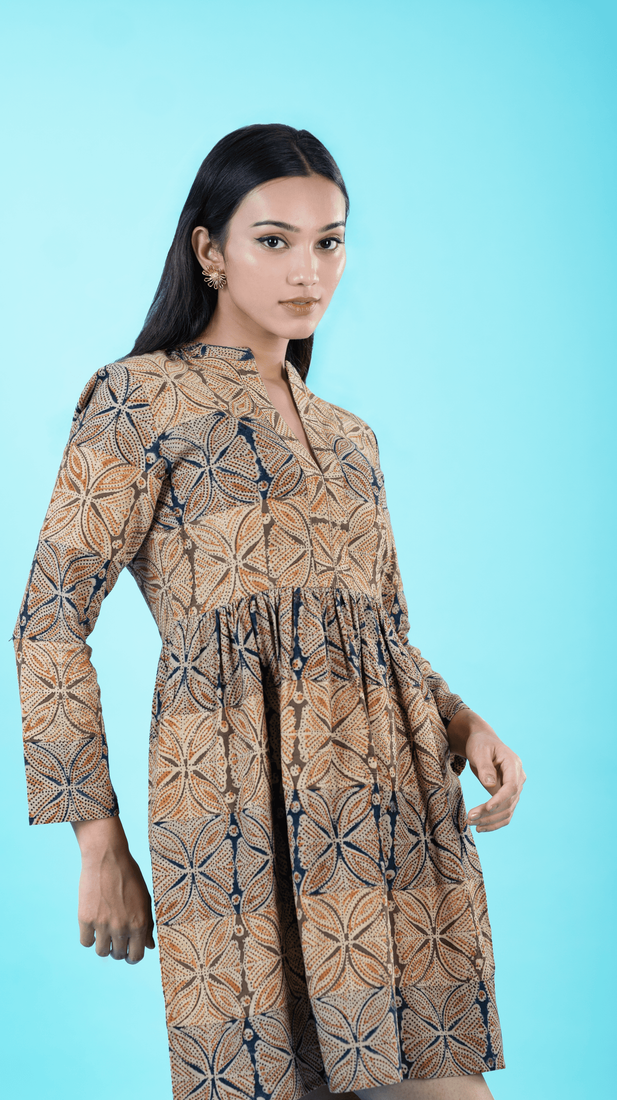 Introducing our 'Fitted Fantasy Patch Dress' in Beige, blending tradition and modernity with a beautifully crafted Chinese neckline and form-fitting silhouette. This cotton dress features a unique patchwork design, perfect for those seeking flare dresses for women. Explore our collection of printed and fitted dresses at Sevy.in!