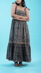 Stylish indigo midi dress for women, made from 100% lightweight cotton, designed as a tie-up strappy dress. This flair dress for women includes practical pockets and stylish panel work, offering both fashion and comfort for any day out. Explore this elegant dress at Sevy.in.