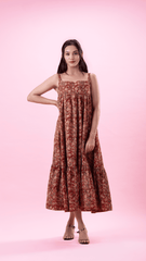 Elevate your wardrobe with the Retro Blossom Frolic dress in empire red, featuring slender strap sleeves and a modern square neckline. This chic, floor-length cotton dress combines fashion-forward design with hidden side pockets for everyday practicality. Perfect for the fashion-conscious individual seeking a stylish midi dress with floral print details.