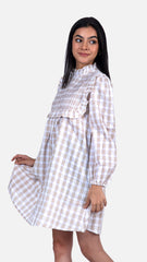 Elevate your style with Sevy's mini checkered dress in beige checks. Crafted from 100% cotton seersucker, it exudes elegance with intricate pintuck detailing. Ideal for both casual and formal occasions, this versatile mini dress is a must-have in every woman's wardrobe. Shop now for short dresses, mini dresses, and check dresses for women at Sevy.in!