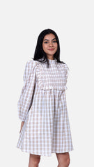 Discover sophistication with Sevy's beige pintucked mini dress in a stylish checkered pattern. Made from 100% cotton seersucker, it offers timeless elegance with its intricate detailing. Perfect for any occasion, from casual outings to formal events, this flared dress is a versatile addition to your collection. Explore our long dresses for women and beige dress options at Sevy.in