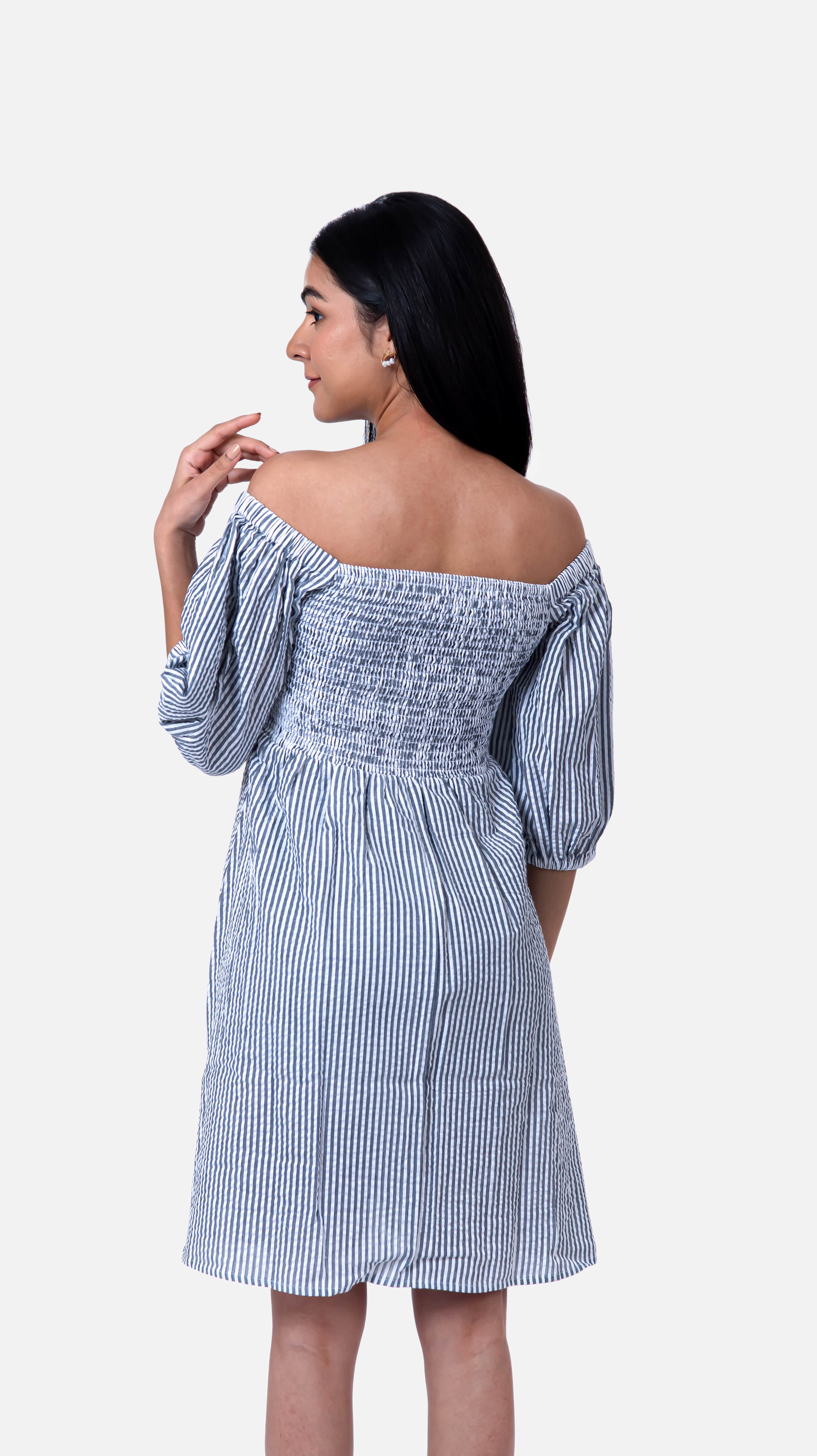 Discover the charm of our Navy Blue Striped A-line mini dress, featuring trendy puff sleeves and a playful stripes pattern. Crafted from 100% cotton seersucker for easy maintenance, it's perfect for any occasion. Explore our collection of flared dresses and striped dresses for women