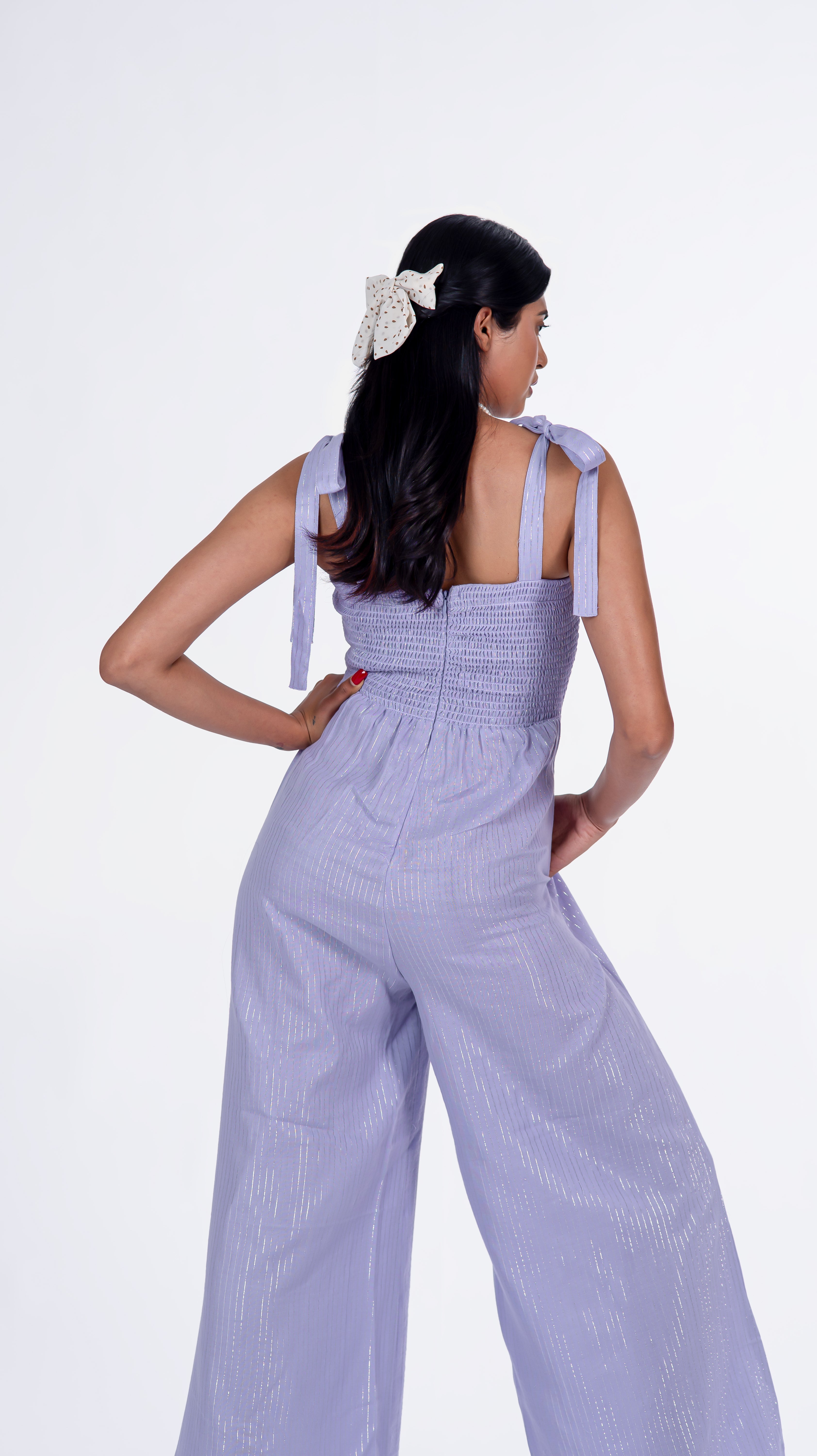 Featuring exquisite knot detailing, this enchanting women's jumpsuit is crafted from premium cotton fabric, exuding elegance and comfort. Ideal for casual outings or formal affairs, this versatile jumpsuit captures attention effortlessly. A prime example of inclusive fashion, it caters to diverse tastes and preferences, making it a must-have women's jumpsuit.