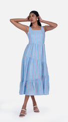 Elevate your wardrobe with Sevy's Ocean Blue Strips midi dress, designed with a sleeveless silhouette and crafted from 100% cotton. Featuring playful three layers of flares and a chic square-cut neckline, it's perfect for the modern woman. Shop now for knee-length dresses for women and printed dresses at Sevy.in!