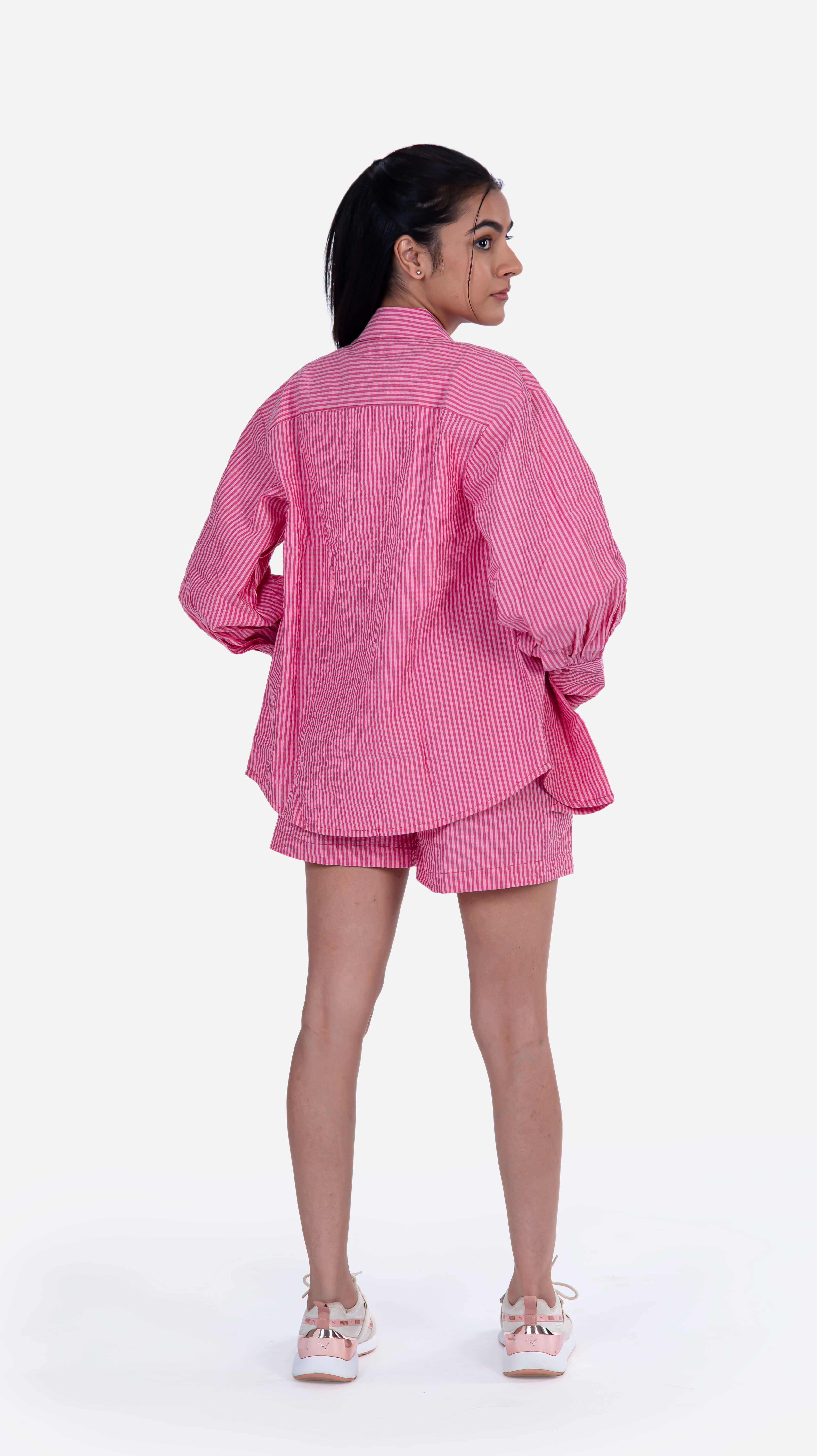 Stylish fuchsia shirt featuring stripes print and voluminous sleeves, crafted from 100% cotton seersucker, perfect for sophisticated fashion