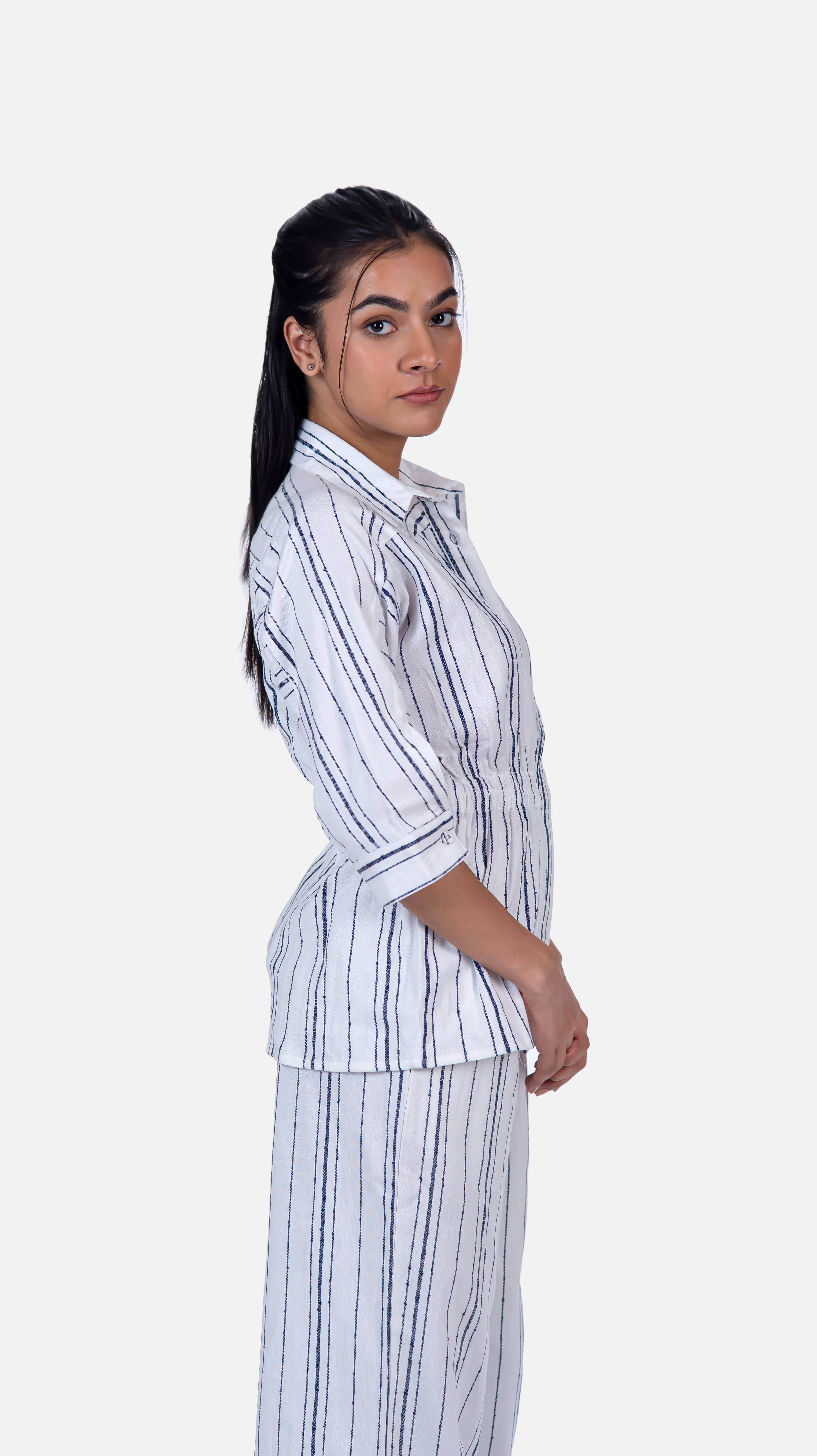 Trendy attire combining a fitted collar shirt corset and flare pants, crafted from high-quality cotton for comfort.