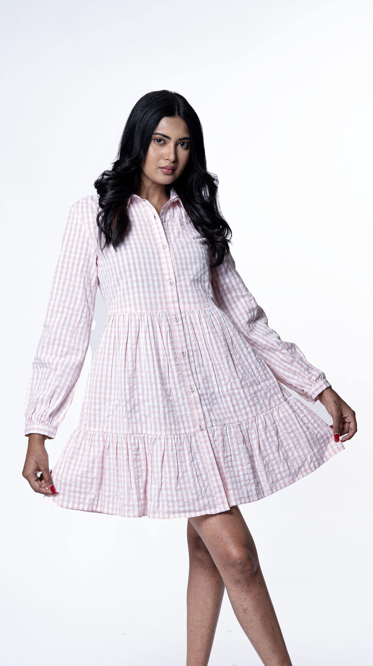 Enhance your wardrobe with our mini collared dress in lush pink checks, featuring a Chinese collar neckline and self-print button details. Made from seersucker cotton, it's an elegant choice for women's mini dresses and collared dress enthusiasts. Buy now to elevate your style!